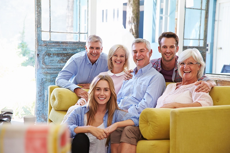Elderly parent and adult child looking at documents